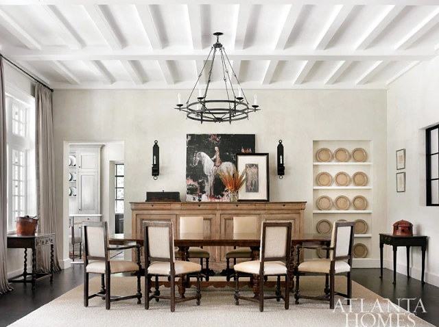 Dining room with a vaulted white plank ceiling and an iron lantern chandelier